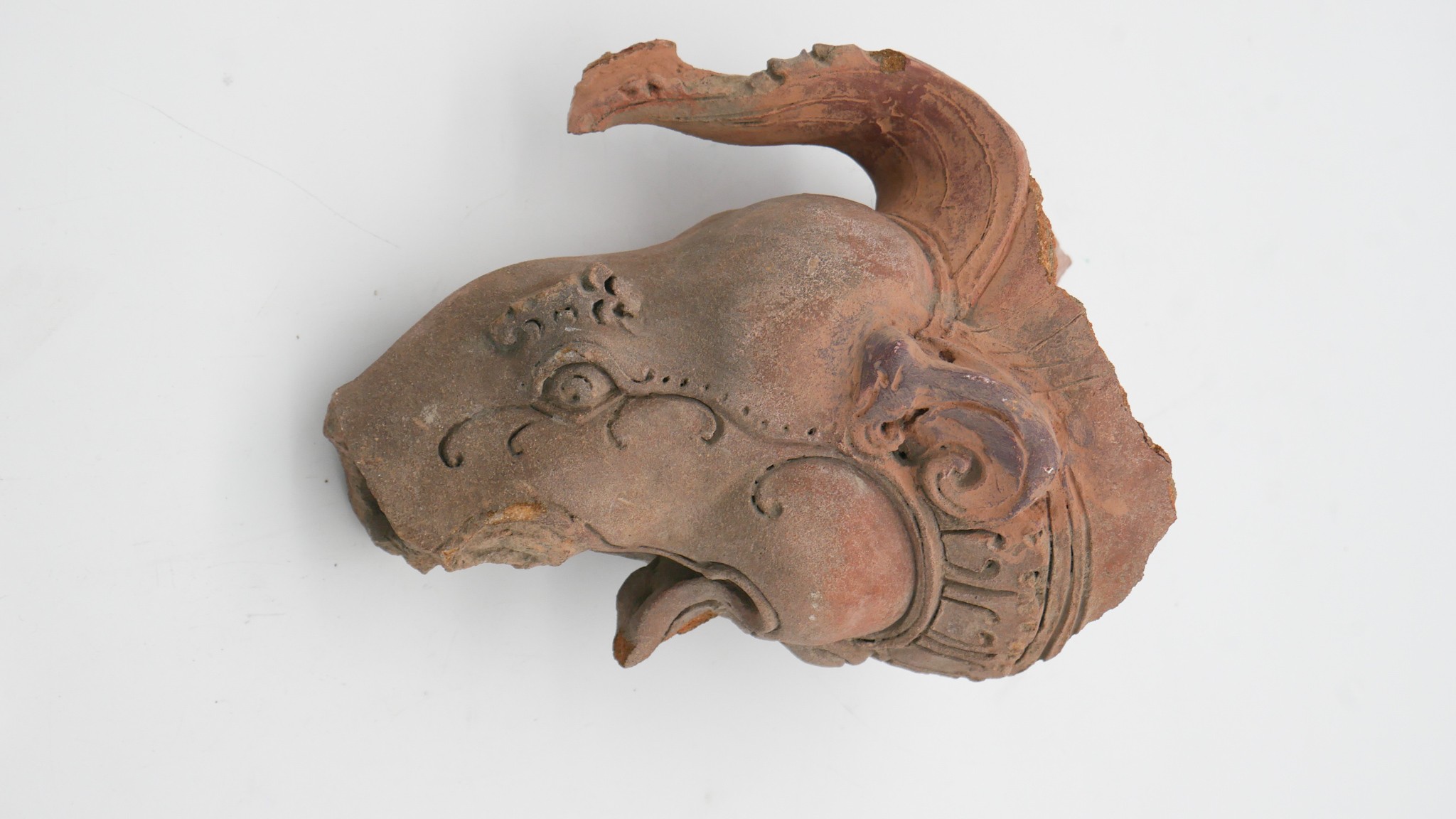 An Oriental terracotta mythical creatures head. H.30 W.19cm - Image 4 of 4