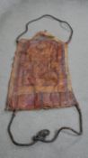 A Tuareg painted camel leather wall hanging with twisted leather cord handles. L. 134 W. 58