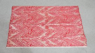 An Islamic replica large fragment of sacred Kiswa in red and white silk. L.110 W.70cm