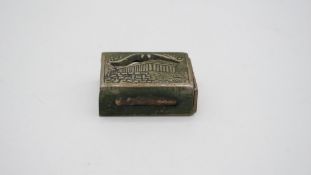 An antique silver plated match box cover with a picture of the Parthenon. W.5