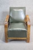 A vintage beech framed armchair in rexine upholstery. H. 67 W.57