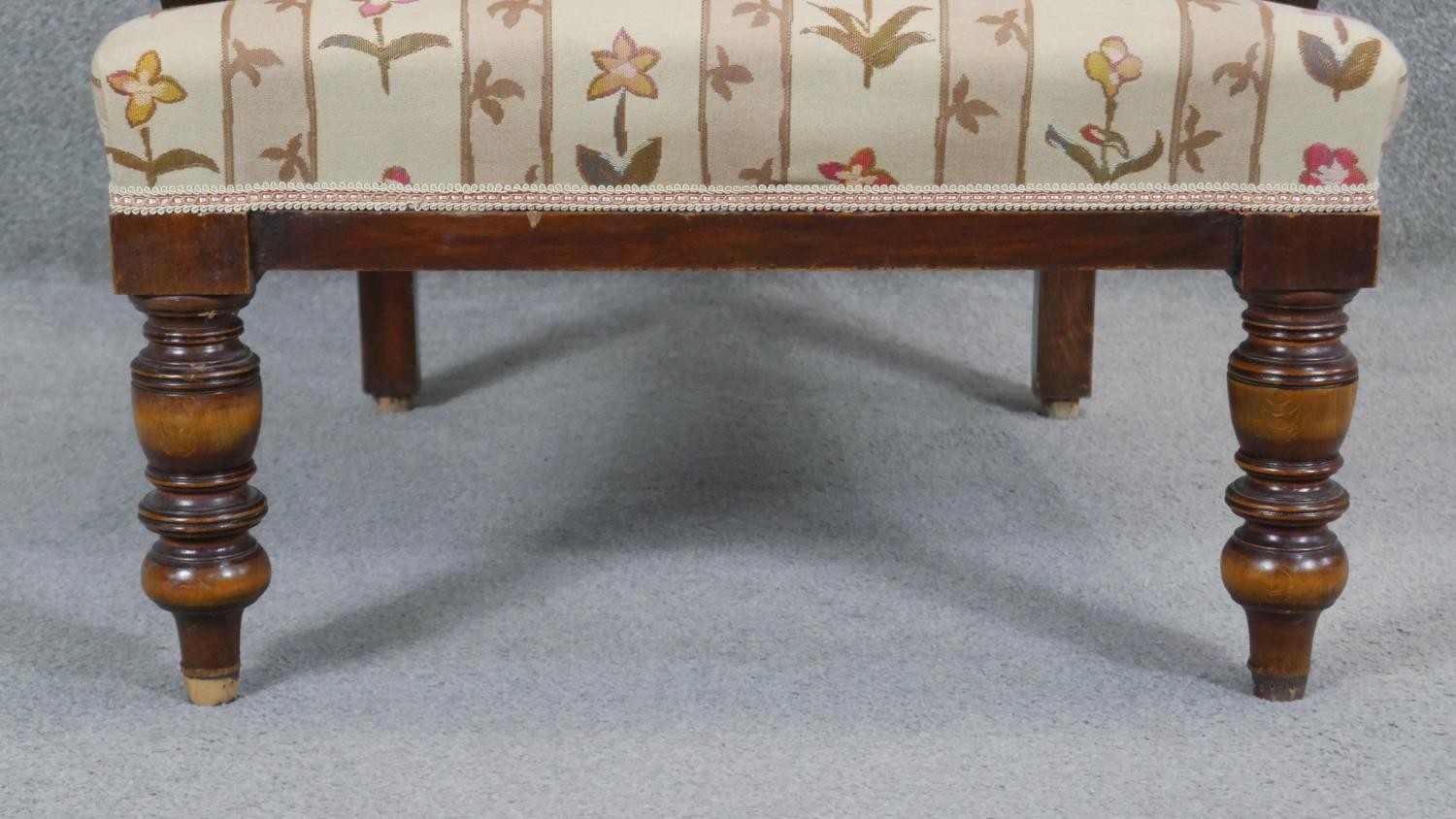 A late 19th century walnut framed armchair in floral upholstery on turned tapering supports. - Image 2 of 7