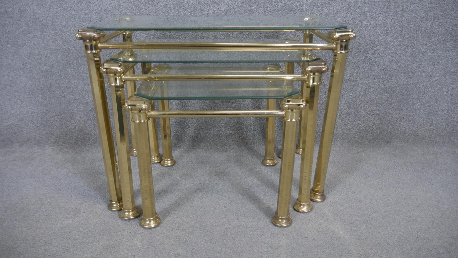 A nest of three Maison Jansen style glass topped occasional tables. H.49 W.63 D.40cm