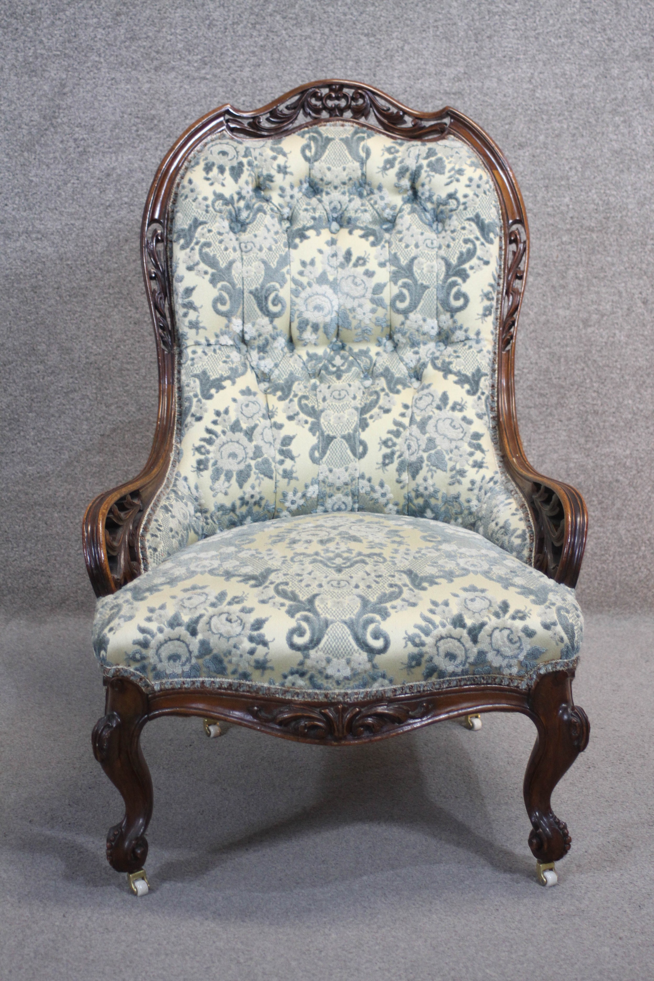 A Victorian rosewood carved frame nursing chair in buttoned upholstery on cabriole supports. - Image 2 of 4