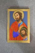 A hand painted religious icon with gilded details. Signed verso. H.30 W.20cm