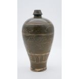 A 19th century Chinese Cizou ware type glazed pottery vase with fish and scrolling motif design. H.
