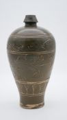 A 19th century Chinese Cizou ware type glazed pottery vase with fish and scrolling motif design. H.