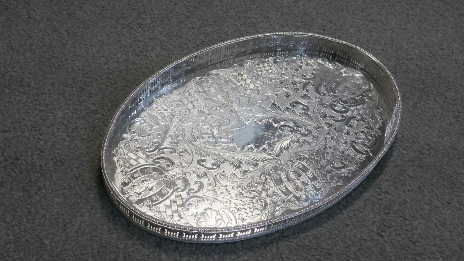 Four oval silver plated serving trays, two with engraved decoration, one with a vine and grape - Image 4 of 4