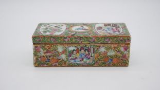A Chinese Famille Rose hand painted porcelain box. Decorated with figures, flowers, butterflies