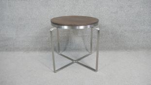 A contemporary brushed metal framed occasional table with inset hardwood top. H.50 Diam.50