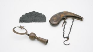 A carved Chinese jade comb along with an Islamic brass finial with a sickle and star and an