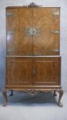 A vintage mid Georgian style burr walnut Epstein drinks cabinet with glazed and fitted interior with