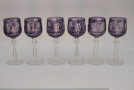 A set of six Bohemian amethyst cut to clear glass hand cut wine glasses with flower and grape