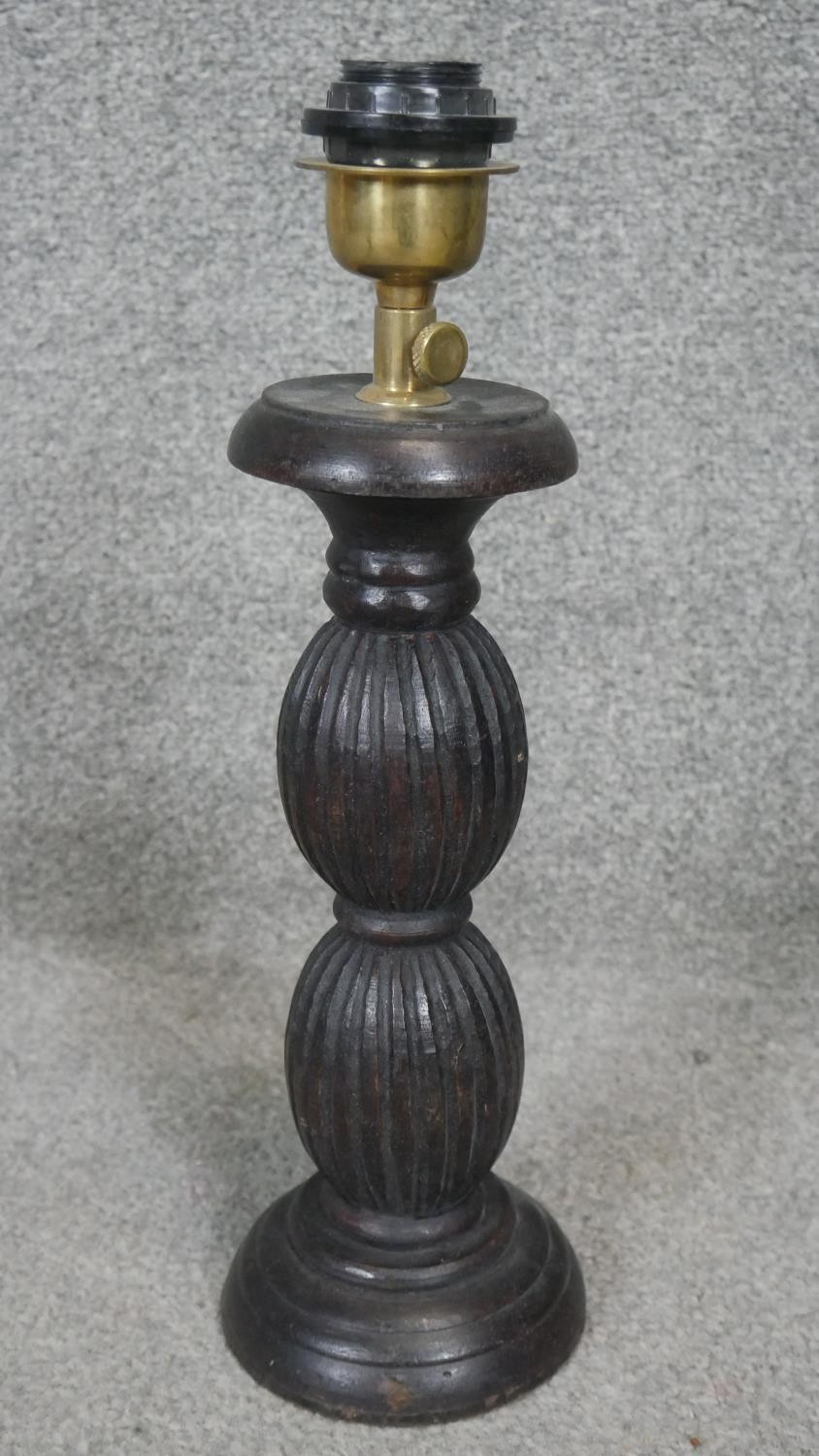 Four carved and stained table lamps with ridged bulbous design. H.53CM - Image 4 of 4