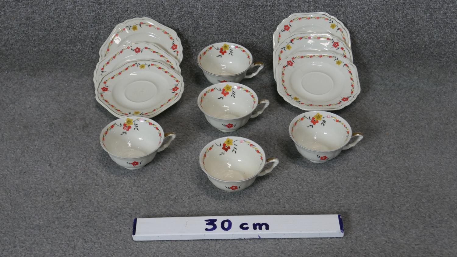 An Art Deco transfer printed floral design six person porcelain tea set (two cups missing), 11 - Image 2 of 5