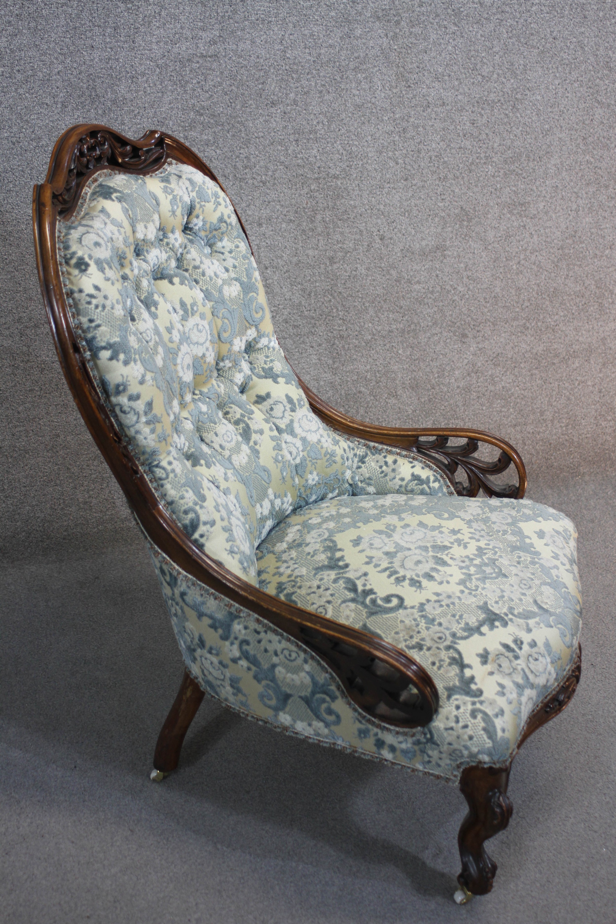 A Victorian rosewood carved frame nursing chair in buttoned upholstery on cabriole supports. - Image 3 of 4