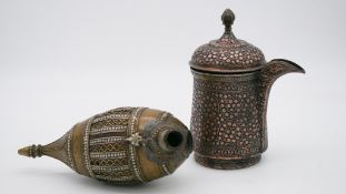 A brass and silver inlaid hookah base along with a copper and silver samovar.