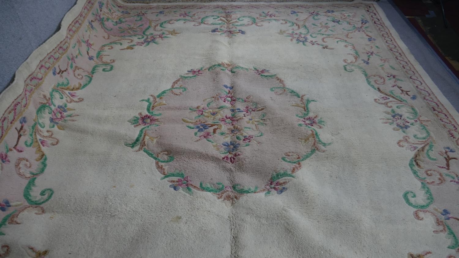 A handmade Indian carpet with central floral spray medallion on a cream ground. 364x273cm - Image 2 of 4