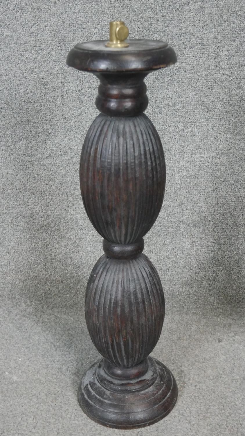 Four carved and stained table lamps with ridged bulbous design. H.53CM - Image 3 of 4