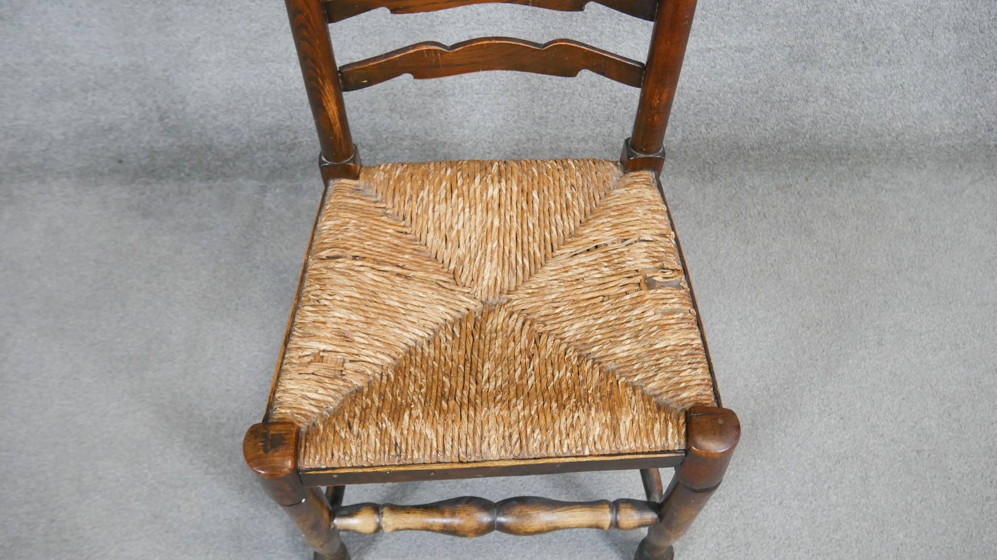 A pair of oak Lancashire style ladder back dining chairs with woven rush seats. - Image 5 of 6