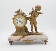 'Enfant Flutiste', a French gilt spelter and marble mantle clock by L&F Moreau. Brass makers