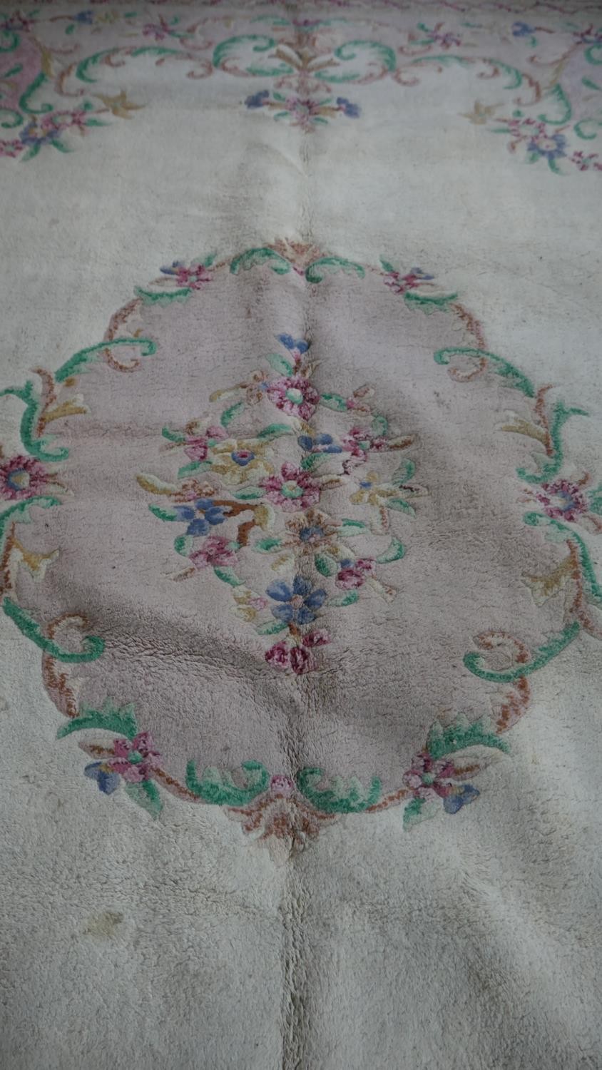 A handmade Indian carpet with central floral spray medallion on a cream ground. 364x273cm - Image 4 of 4