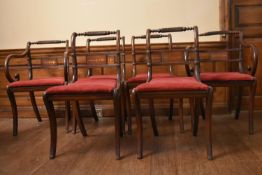 A set of six Regency brass inlaid mahogany dining chairs with rope twist back rails and drop in