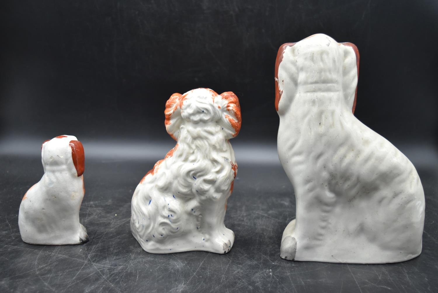 A collection of three 19th century tan and white Staffordshire spaniels. Largest H.26 W.19cm (3) - Image 6 of 9