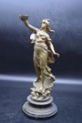 A spelter figure of a Greek goddess standing on a painted stepped base, marked. H.37 Dia.16cm