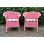 A pair of Lloyd Loom vintage wicker conservatory armchairs with fitted seats. H.83 W.73 D.50cm