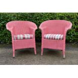 A pair of Lloyd Loom vintage wicker conservatory armchairs with fitted seats. H.83 W.73 D.50cm