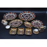 A part Royal Crown Derby tea set. Including, wall hanging plate, two side plates, a miniature cup