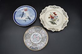 Two 20th century Wedgwood wall plates, one with painted floral design and the other 'Commemoration