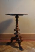 A 19th century burr walnut occasional table with carved moulded top with central inlaid cartouche