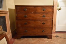 A Georgian mahogany chest of drawers on shaped bracket feet. H.100 W.108 D.50cm