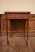 An Edwardian mahogany and satinwood inlaid swivel action envelope card table on slender square