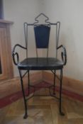 A wrought iron painted conservatory armchair on twist stretchered splay supports. H.94 W.40 D.39cm