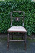 A Regency ebonised bedroom chair. H.83 W.40 D.35cm