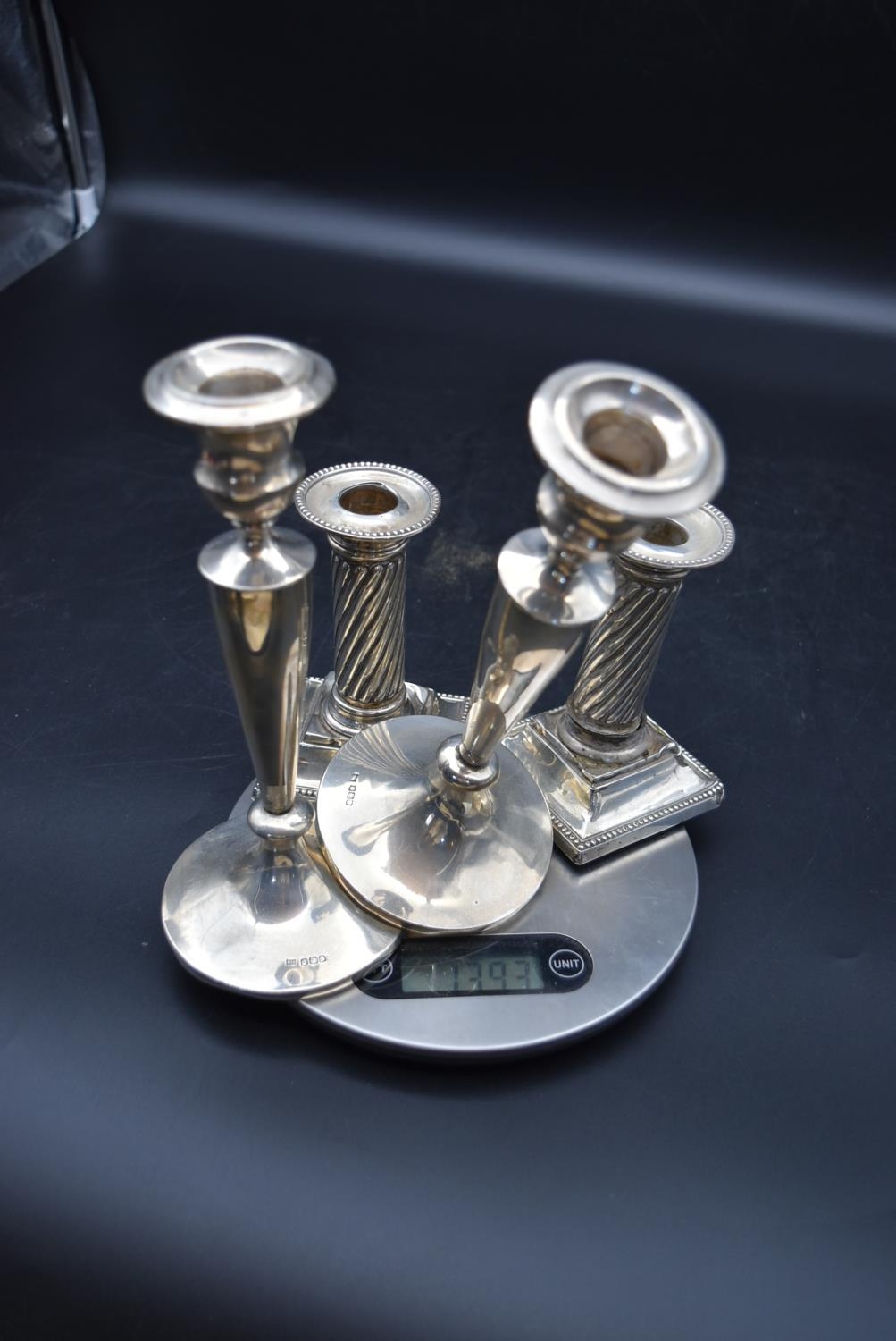 A pair of silver candlesticks with a twisted style to the column and beading decoration to the base, - Image 11 of 13