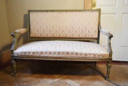 A late C19th painted frame Louis XVI style canape in floral upholstery on tapering fluted