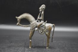 Benin Bronze - A tribal bronze figure of a man riding his horse. H.23 W.20cm