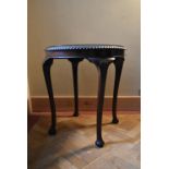 A mid century mahogany Georgian style occasional table with plate glass top on carved cabriole
