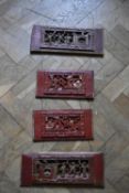 A set of four Chinese carved and pierced lacquered wall hanging panels. H.76 W.36cm.