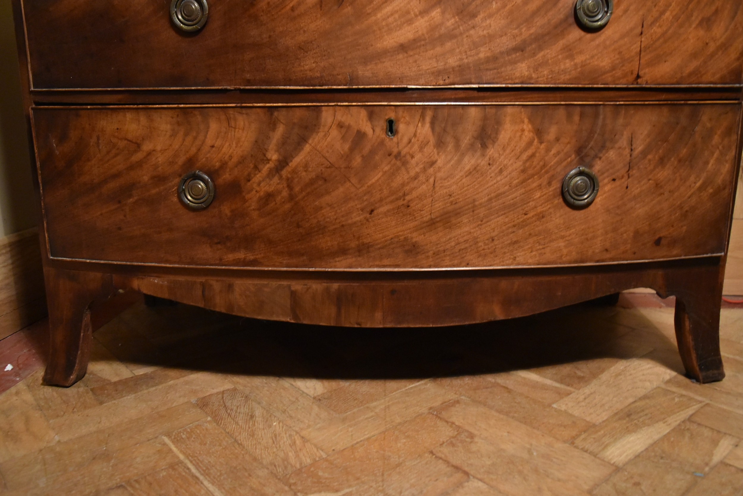 A Georgian flame mahogany bow fronted chest on swept bracket supports., H.107 W.109 D.52cm - Image 6 of 7