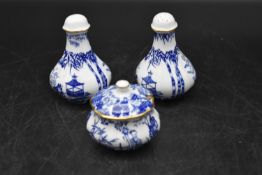 A set of Royal Crown Derby Salt and Pepper shakers, decorated with oriental scenes, along with