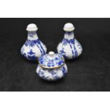 A set of Royal Crown Derby Salt and Pepper shakers, decorated with oriental scenes, along with