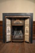 A late 19th century cast iron Fire surround with ornate metalwork and foliate ceramic tile design.