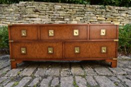 A military style brass bound burr maple low chest with inset handles on shaped bracket feet. H.52