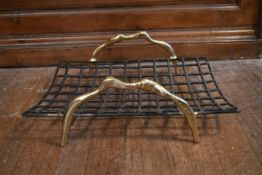 A contemporary wrought iron log basket with brass handles, designed by David Marshall. H.18 W.55 D.