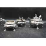 A Georgian three piece silver tea set by Hyam Hyams. To include a teapot, a milk jug and a twin